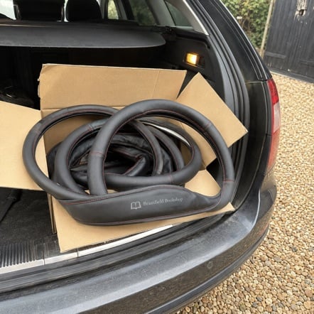 Branded steering wheel covers with logo
